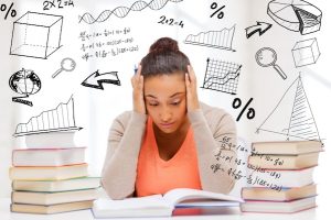 education and college concept - tired student with pile of books and notes studying indoors